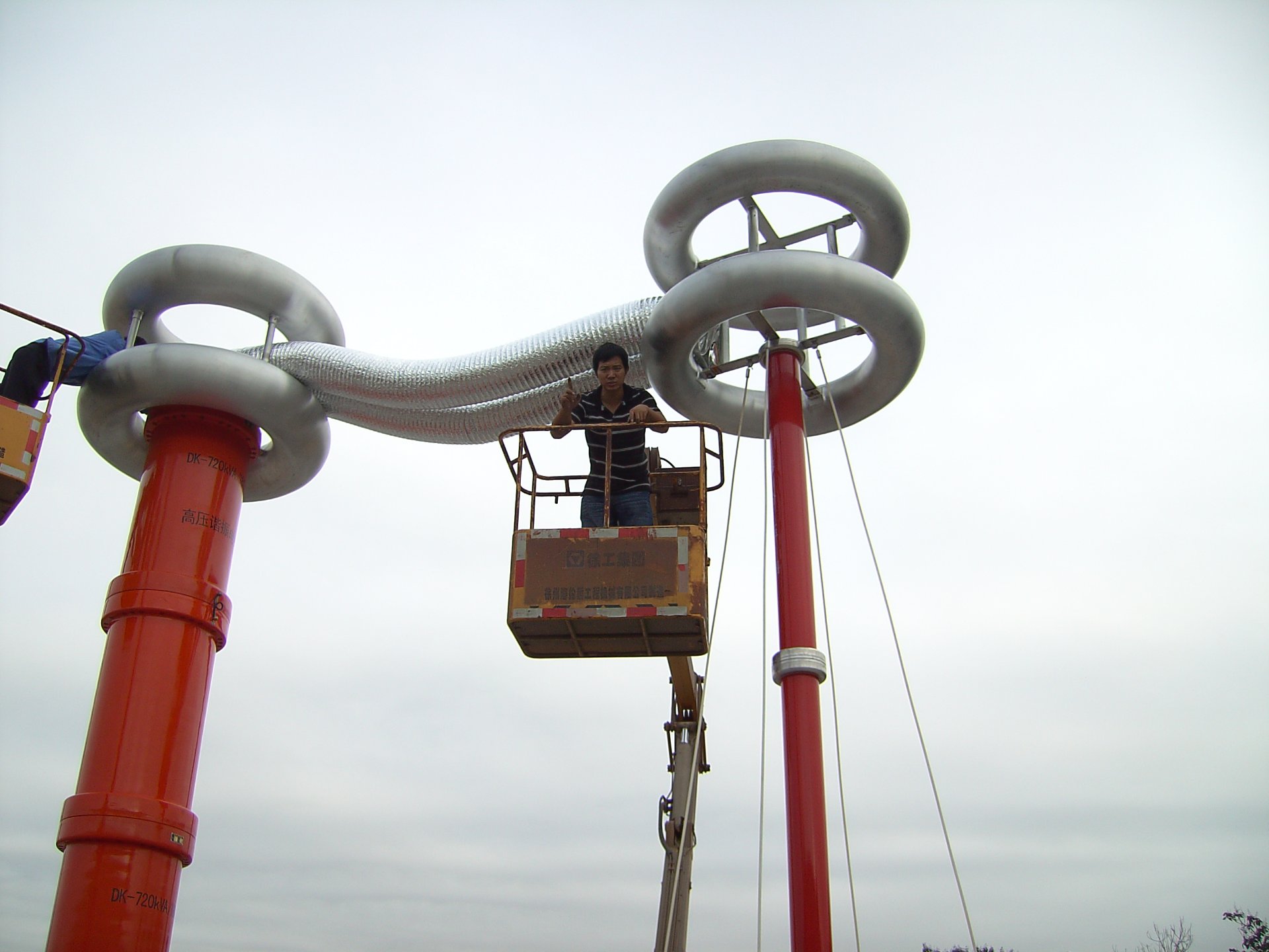High voltage equipment and an engineer at a field installation